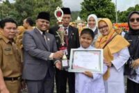 Emrizal menghadiri upacara Hari Kesehatan Nasional ke-61 di Sungai Penuh.