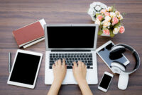 Closeup of business woman hand typing on laptop keyboard