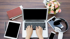 Closeup of business woman hand typing on laptop keyboard