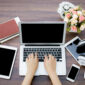 Closeup of business woman hand typing on laptop keyboard