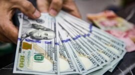Nilai tukar dolar AS menguat terhadap rupiah usai pengunduran diri Gubernur Bank Indonesia Perry Warjiyo.(Foto: Andhika Prasetia/detikFoto)