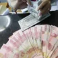 Nilai tukar rupiah menguat terhadap dolar AS pada perdagangan terbaru. ( Foto : Liputan6.com/Angga Yuniar)