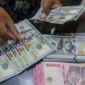 Rupiah diprediksi melemah terhadap dolar AS pada perdagangan Jumat, 14 Agustus 2026.(Foto : Bisnis/Himawan L Nugraha)
