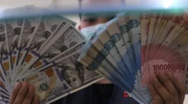 Rupiah kembali melemah terhadap dolar AS pada penutupan perdagangan Senin, 14 September 2026. (Foto : Liputan6.com/Angga Yuniar) 