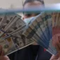 Rupiah kembali melemah terhadap dolar AS pada penutupan perdagangan Senin, 14 September 2026. (Foto : Liputan6.com/Angga Yuniar) 