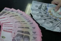 Ilustrasi rupiah dan dolar AS yang menggambarkan pergerakan nilai tukar mata uang.(Foto : The Fed/TRIBUNNEWS/IRWAN RISMAWAN)