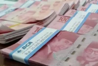 Rupiah masih menghadapi tekanan akibat konflik Iran-AS, harga minyak, dan kebijakan The Fed.(Foto : WARTA KOTA/HENRY LOPULALAN/tribunnews.com)
