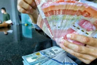 Rupiah melemah terhadap dolar AS di tengah tekanan pasar domestik dan ketegangan geopolitik global.(Foto : Liputan6.com/Angga Yuniar)