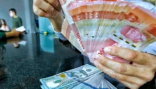 Rupiah melemah terhadap dolar AS di tengah tekanan pasar domestik dan ketegangan geopolitik global.(Foto : Liputan6.com/Angga Yuniar)