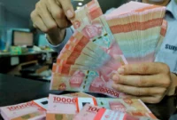 Rupiah melemah ke Rp18.035 per dolar AS seiring tekanan pasar global dan kenaikan harga minyak.(Foto : Liputan6.com/Angga Yuniar)